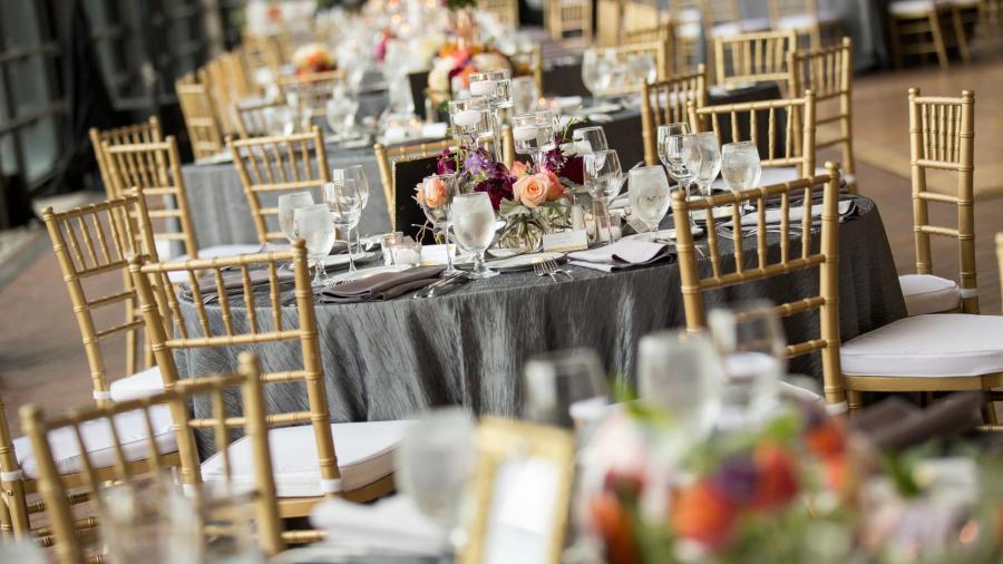 Decorated tables and gold chairs